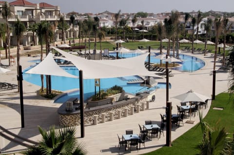 Dive into resort pools framed by palms and open skies.