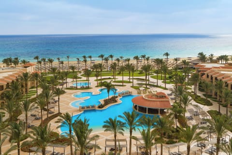 Soak up sunshine with panoramic sea views beyond the pool.