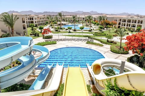 Feel the thrill of waterslides with resort panoramas ahead.