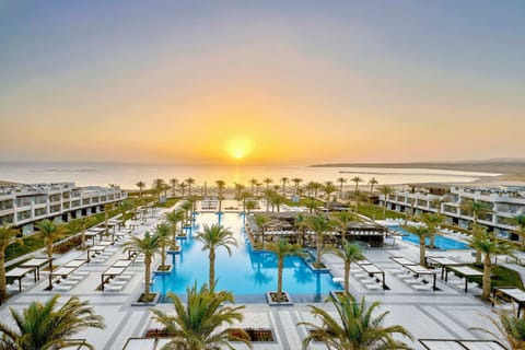 Wake to golden sunrise views over the sparkling pool.