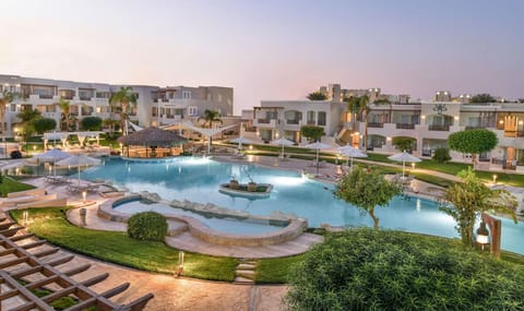 Unwind at dusk as the lagoon pool glows beautifully.