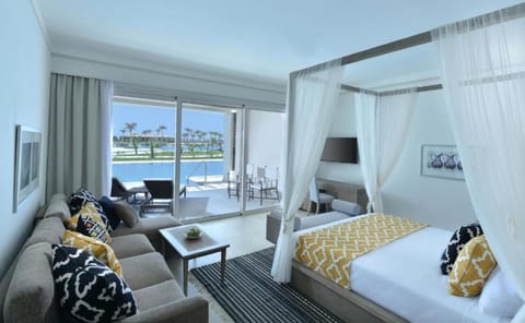 Wake up to pool-and-ocean views from your airy suite.