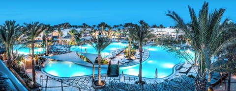 Dive into glowing lagoon pools under dreamy evening skies.