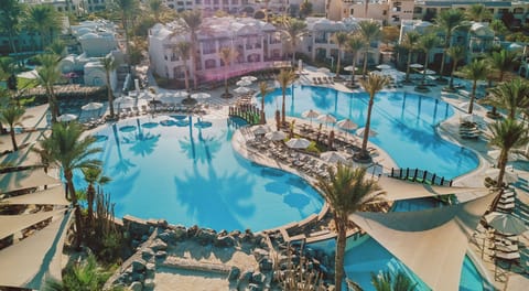 Soak up sunshine beside sweeping lagoon pools and loungers.