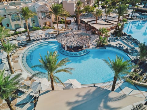 Sip and swim around the shaded pool bar oasis.
