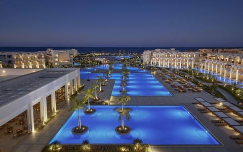 Soak up sunrise views over expansive pools and sea.
