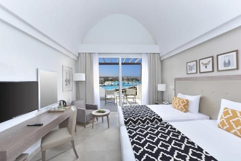 Relax in twin beds with sun-filled terrace scenery.