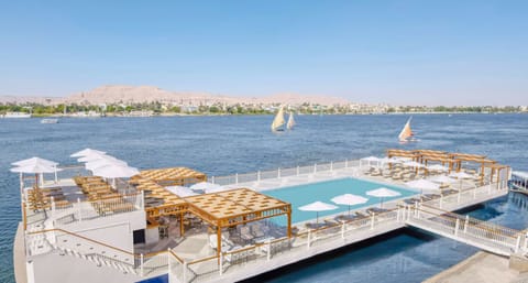 Float above the river on a chic pool deck.