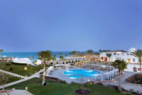 Arrive to sweeping sea views and palm-lined serenity.