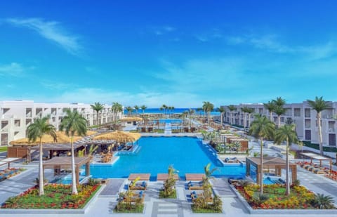 Dive into endless blue with panoramic resort-and-sea views.