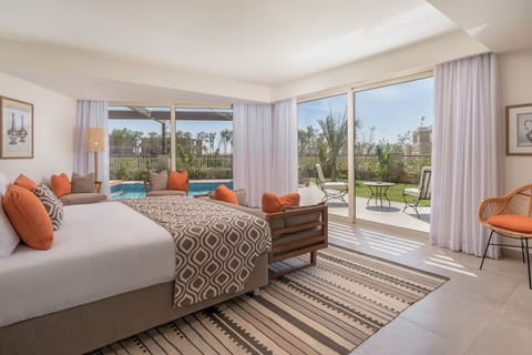 Lounge in crisp linens with garden views and soft daylight.