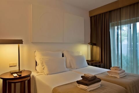 Sink into plush pillows and enjoy a calm, cozy night.
