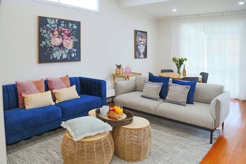Bright and comfy living area for relaxing. 2 x 3 seater couches and dining table for up to 6 people.  