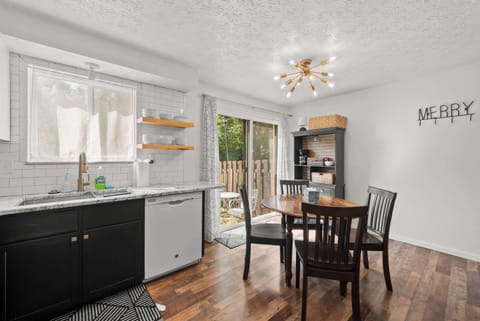 The sleek eat-in kitchen offers ample space & all the comforts of home​