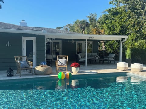 Relax by the pool in your private tropical oasis