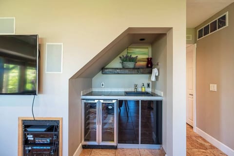 First floor wine fridge and bar