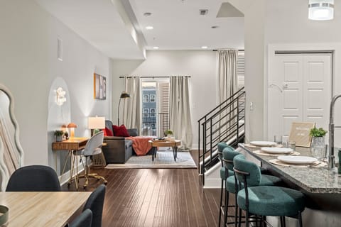 Stylish living area seamlessly connected to the kitchen—perfect for socializing or relaxing.