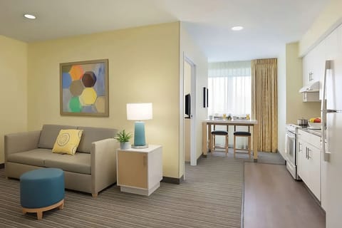 Unwind on the sofa after cooking in your suite.