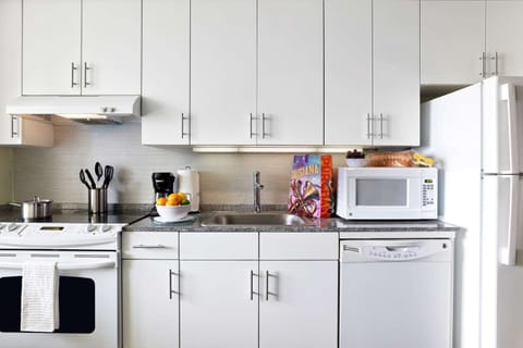 Cook comfortably with a full kitchenette and ample counter space.