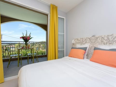 Wake up to fresh air and balcony views beside you.