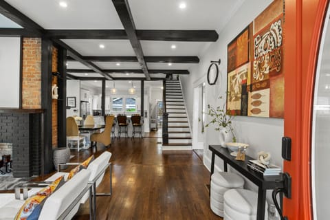 Welcome in—open layout with exposed beams and curated art