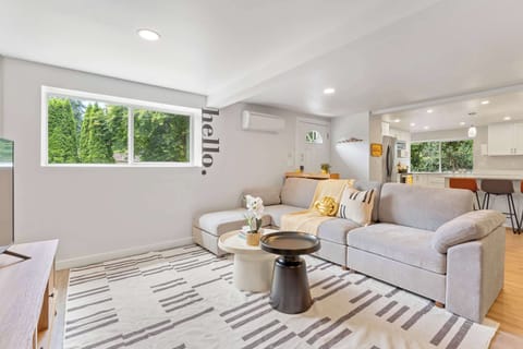 Seamless flow between living and kitchen spaces, designed for gatherings.