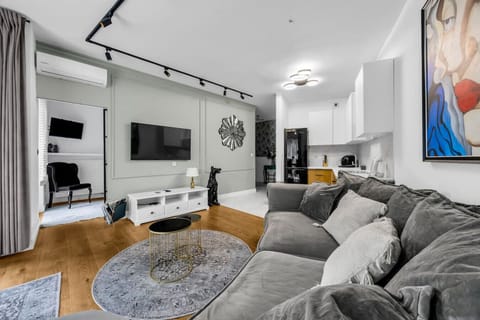 Living Room with Sofa, Smart TV and Dining Table | Book Now with RENTUJEMY.COM