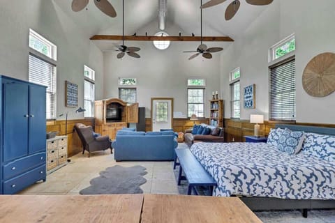 Living Area: Relax in style with vibrant decor, soaring ceilings, and plenty of natural light!