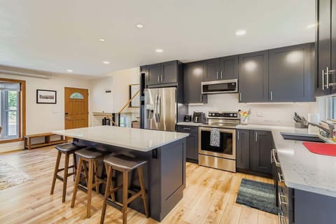 Front door opens into the kitchen, offering quick access for groceries and everyday use