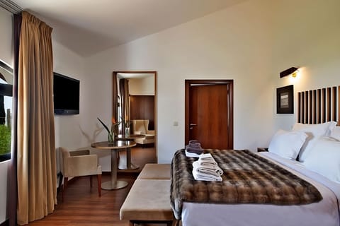 Settle in with a cozy workspace and restful bed nearby.