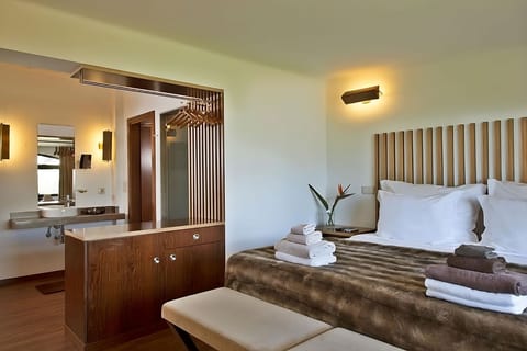 Settle in with airy space, sleek vanity, and plush throws.
