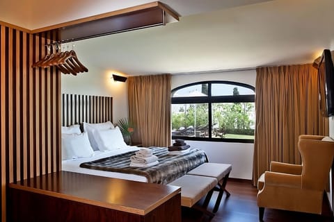 Stretch out in a spacious room with lounge chair and views.