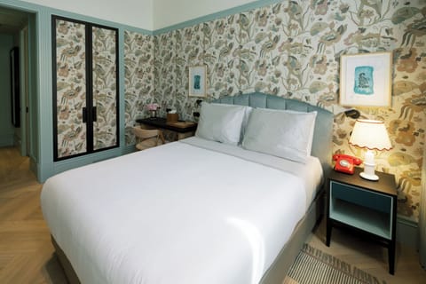 Settle into a serene bedroom with plush bedding and style.