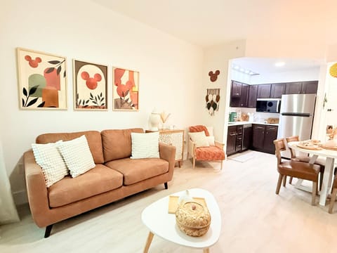 Charming, sunlit living room with stylish decor and comfy seating.