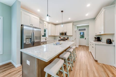 Gourmet Kitchen with huge Island and Stainless Appliances.