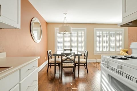 Enjoy sunny meals at the dining table beside the kitchen.