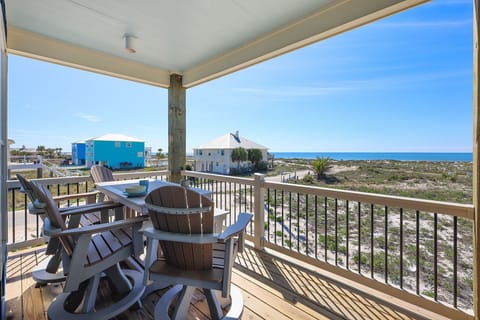 Enjoy a relaxing meal on the balcony of either of the Cole's Houses with a view of the serene coastline