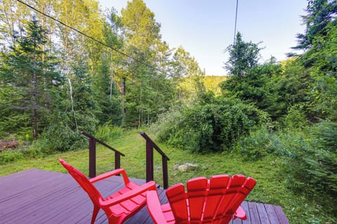Cabin Exterior | Front Porch w/ Seating | Wooded Surroundings