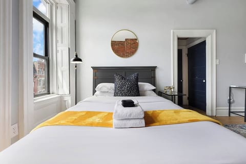 Spacious and elegant queen-sized bedroom designed for comfort and style.