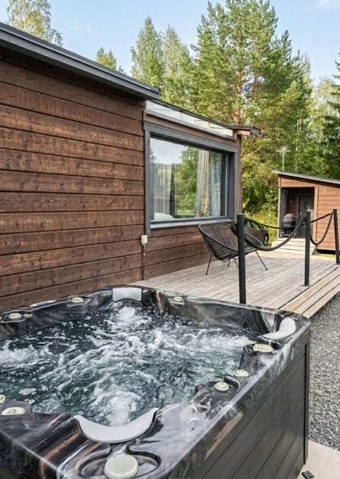 The private outdoor hot tub is ready for year-round relaxation, offering the perfect spot to unwind after a day of outdoor activities.