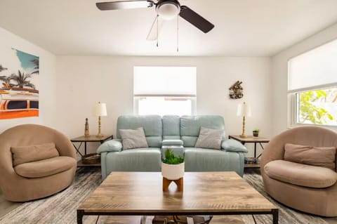 A couch and 2 chairs for seating