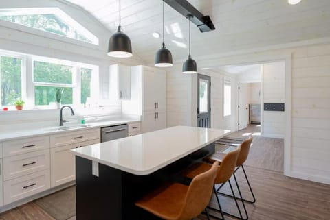 Brightly lit kitchen island, a great space to meal prep or use to set up a buffet-style meal!