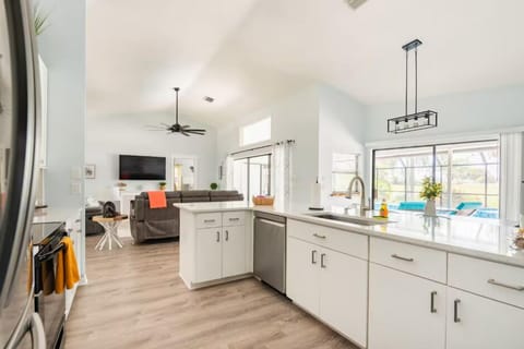 Open kitchen equipped with sink & dishwasher