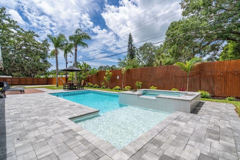 In the backyard there is a heated pool and spa along with a paved patio all around