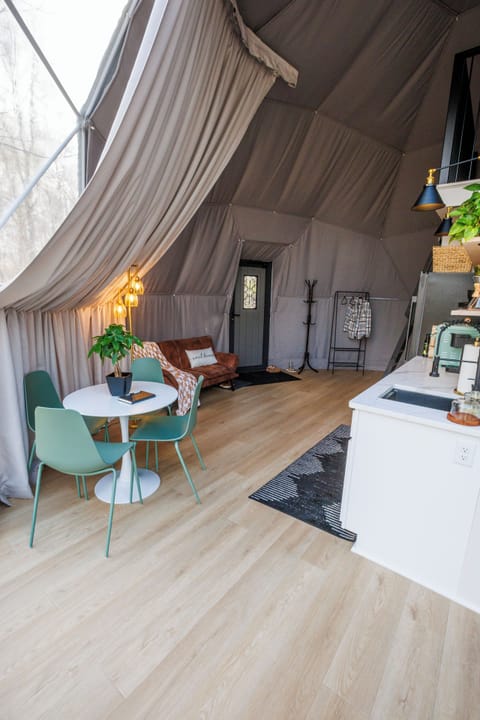 Living room, dining area, entrance, and kitchenette