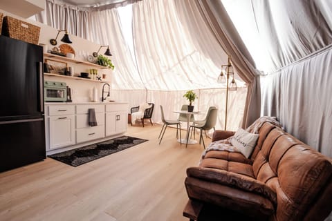 Living room, dining area, and kitchenette.