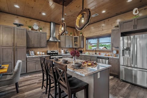 Large fully stocked kitchen with island.