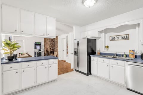 Kitchen that leads into the game room.