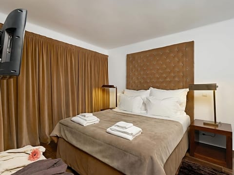 Relax in a cozy, boutique-style room with plush headboard.