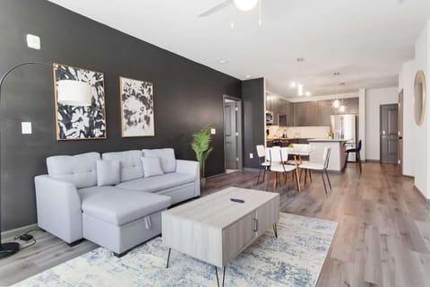 Relax in style amidst tasteful decor and ample light. Our cozy living room offers comfort and chic design for your perfect retreat.